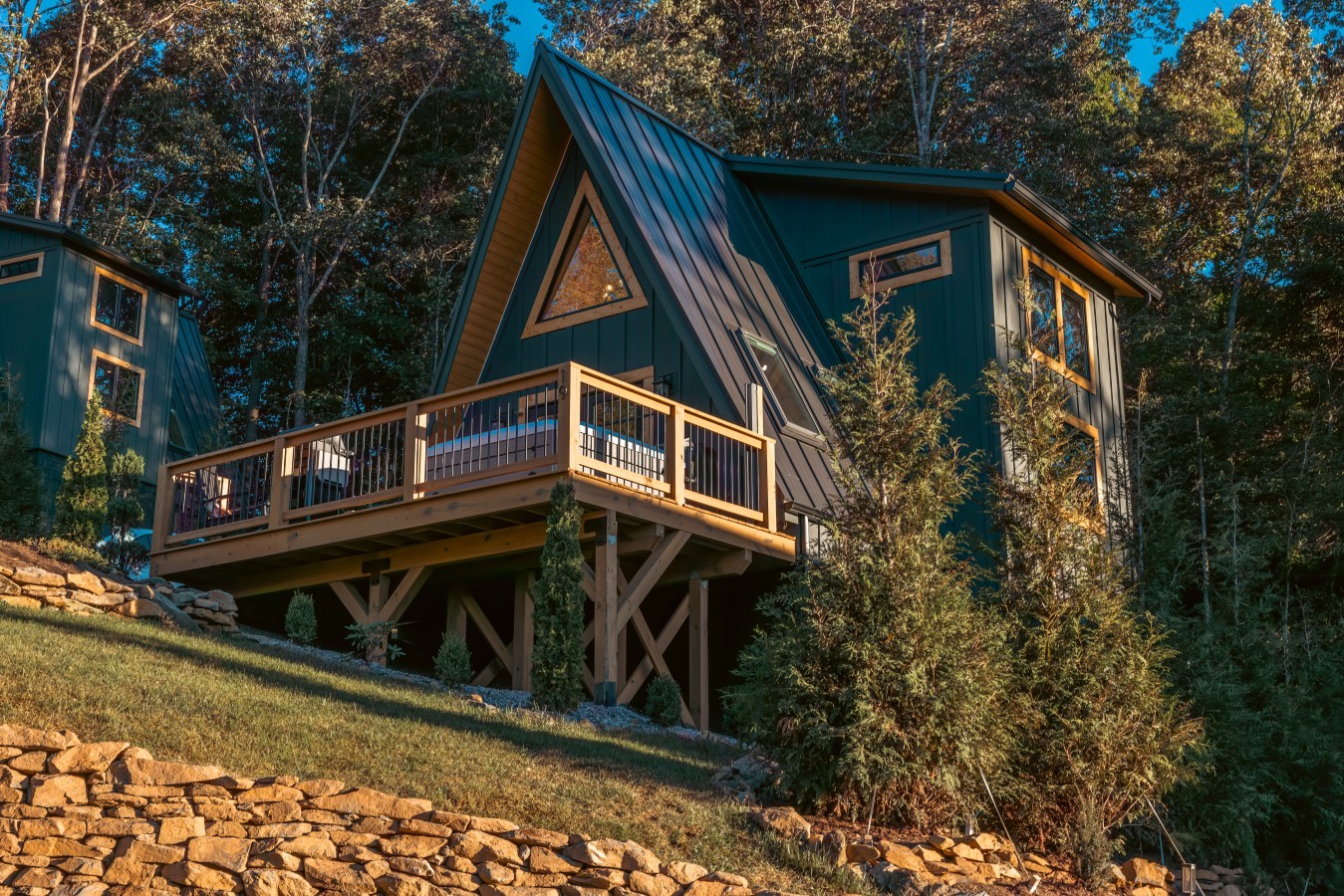 A-frame cabin with large deck on the mountainside